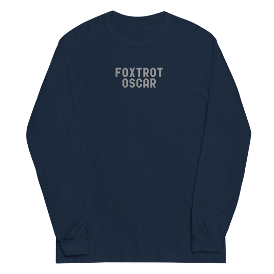 "Foxtrot Oscar" printed on a navy men's long sleeve shirt laying on a flat surface