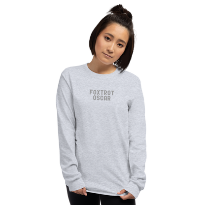 "Foxtrot Oscar" printed on a sport grey men's long sleeve shirt worn by a female
