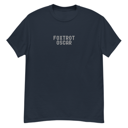 "Foxtrot Oscar" printed on a navy unisex classic tee laying on a flat surface