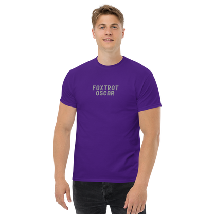 "Foxtrot Oscar" printed on a purple unisex classic tee worn by a male