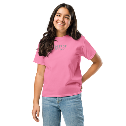 "Foxtrot Oscar" printed on a azalea youth classic tee worn by a female