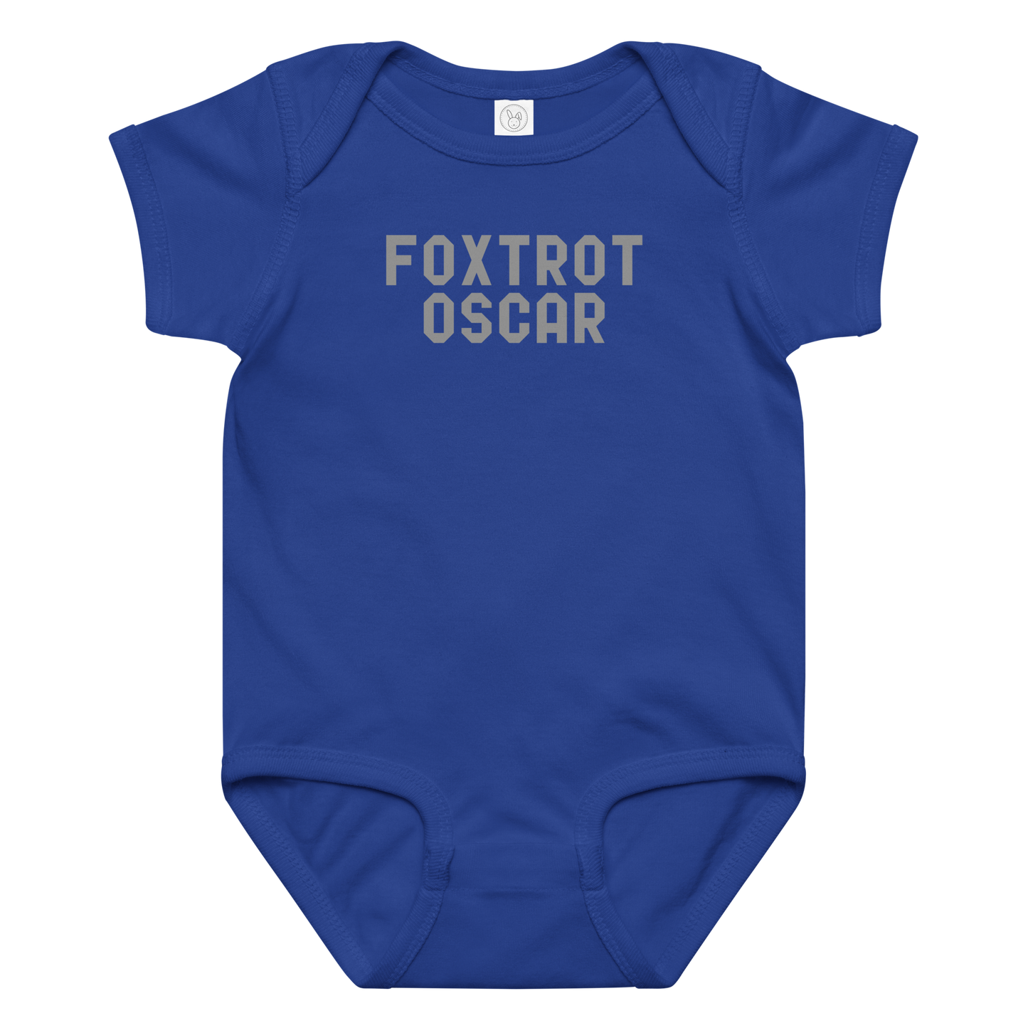 "Foxtrot Oscar" printed on a royal baby jersey bodysuit laying on a flat surface amongst other clothes