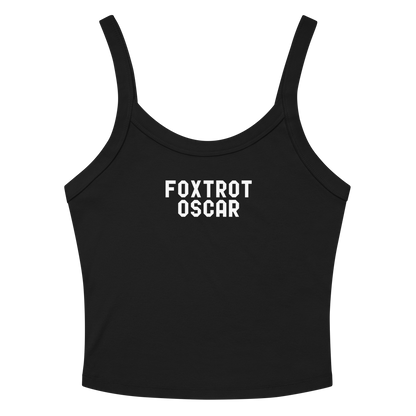 "Foxtrot Oscar" printed on a solid black blend women's micro-rib tanktop laying on a flat surface amongst sunglasses and shorts