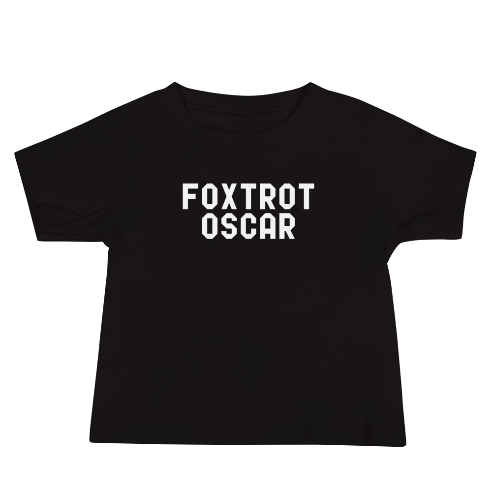 "Foxtrot Oscar" printed on a black baby jersey short sleeve tee laying on a flat surface