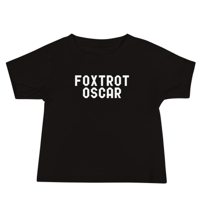 "Foxtrot Oscar" printed on a black baby jersey short sleeve tee laying on a flat surface