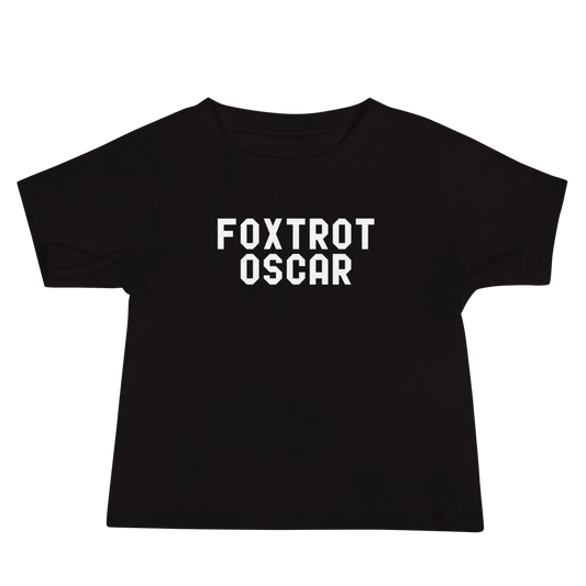 "Foxtrot Oscar" printed on a black baby jersey short sleeve tee laying on a flat surface