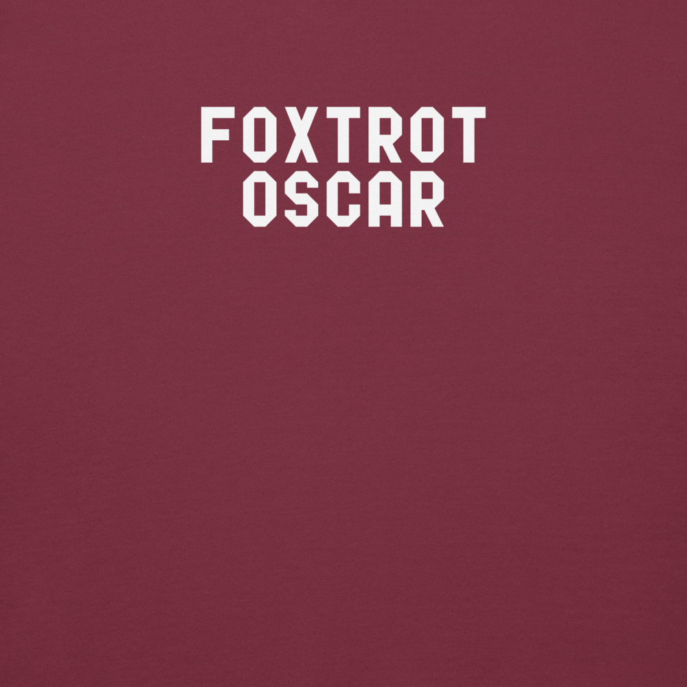 "Foxtrot Oscar" printed on a maroon background