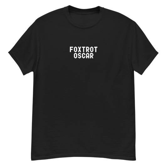 "Foxtrot Oscar" printed on a black unisex classic tee laying on a flat surface