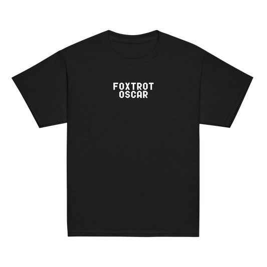 "Foxtrot Oscar" printed on a black youth classic tee laying on a flat surface