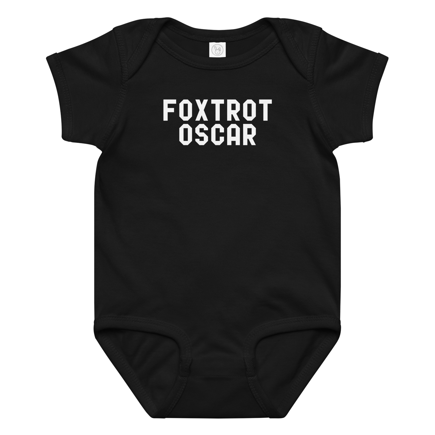 "Foxtrot Oscar" printed on a black baby jersey bodysuit laying on a flat surface amongst other clothes
