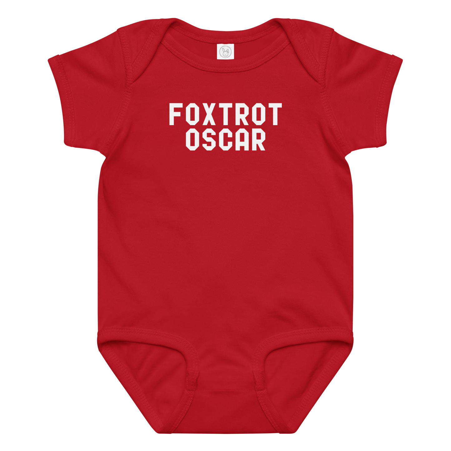 "Foxtrot Oscar" printed on a red baby jersey bodysuit laying on a flat surface amongst other clothes