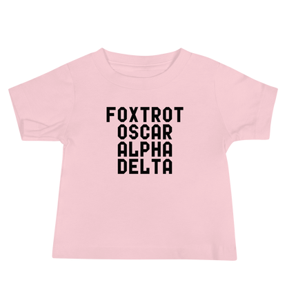 "Foxtrot Oscar Alpha Delta" printed on a pink baby jersey short sleeve tee laying on a flat surface
