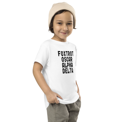 "Foxtrot Oscar Alpha Delta" printed on a white toddler short sleeve tee worn by a male who is also wearing a knit cap