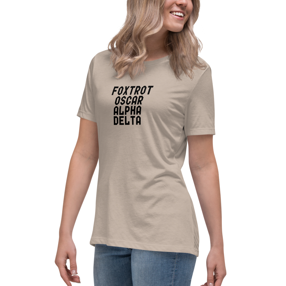 "Foxtrot Oscar Alpha Delta" printed on a heather stone women's relaxed t-shirt worn by a female