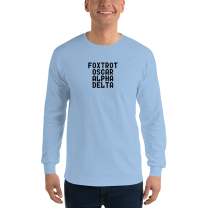 "Foxtrot Oscar Alpha Delta" printed on a light blue men's long sleeve shirt worn by a male