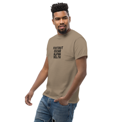 "Foxtrot Oscar Alpha Delta" printed on a brown savana unisex classic tee worn by a male