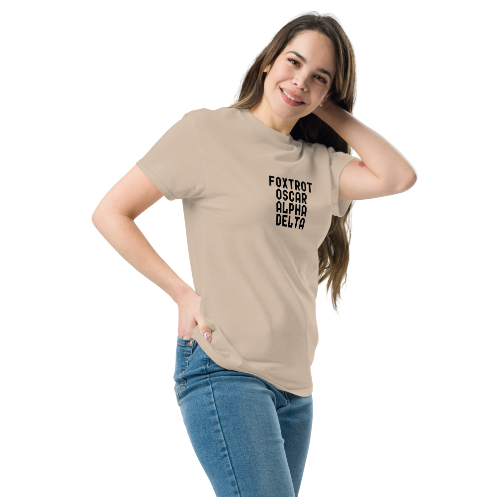 "Foxtrot Oscar Alpha Delta" printed on a sand unisex classic tee worn by a female