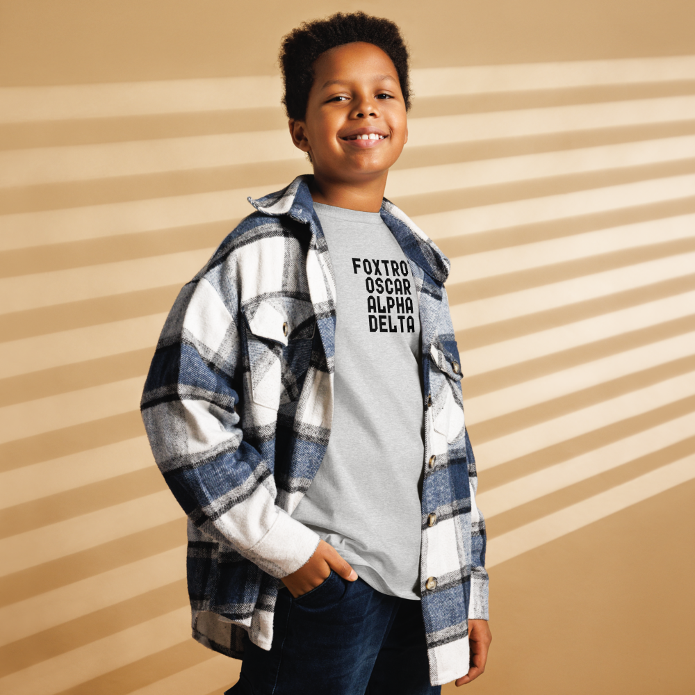 "Foxtrot Oscar Alpha Delta" printed on a sport grey youth classic tee worn by a male also wearing a jacket