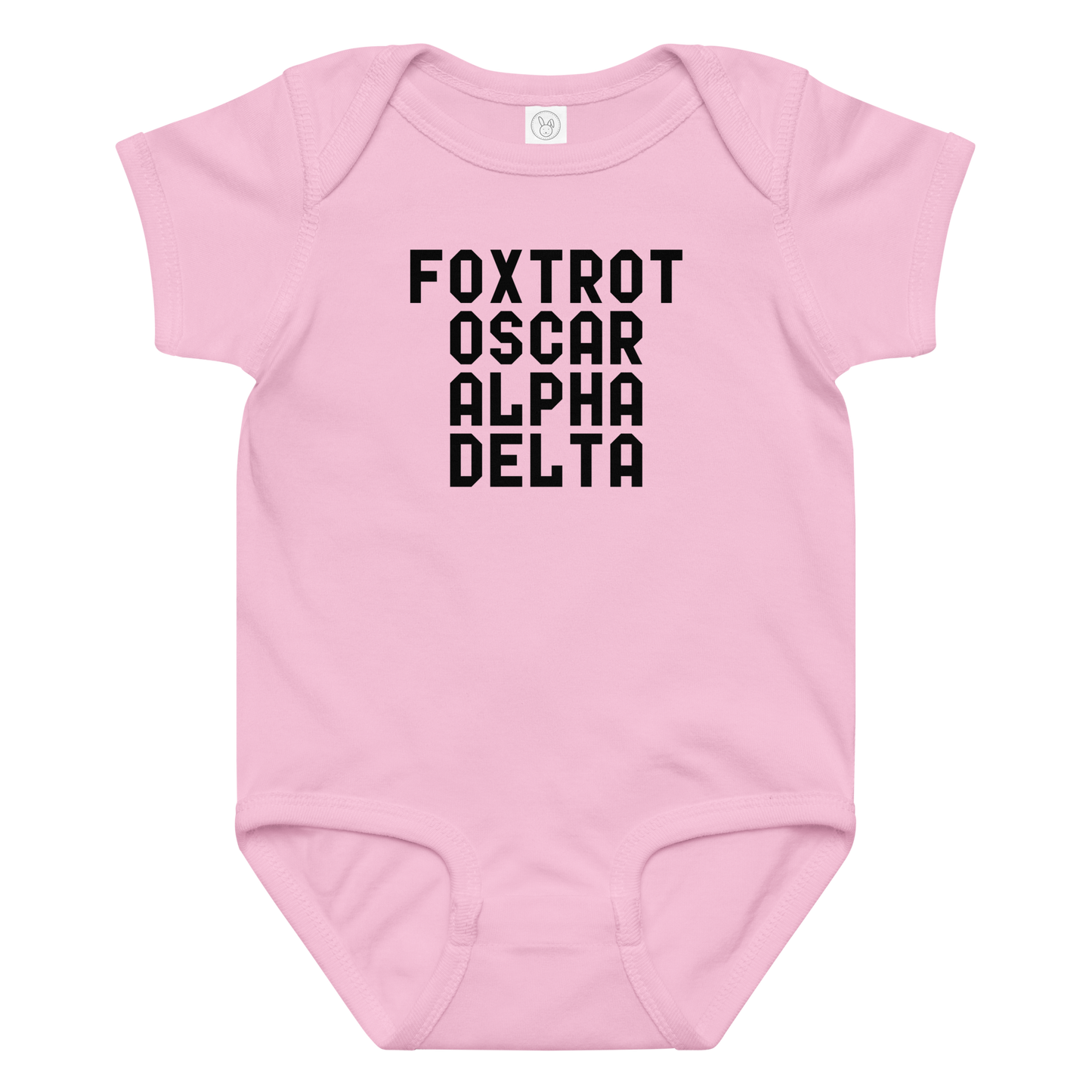 "Foxtrot Oscar Alpha Delta" printed on a pink baby jersey bodysuit laying on a flat surface amongst other clothes