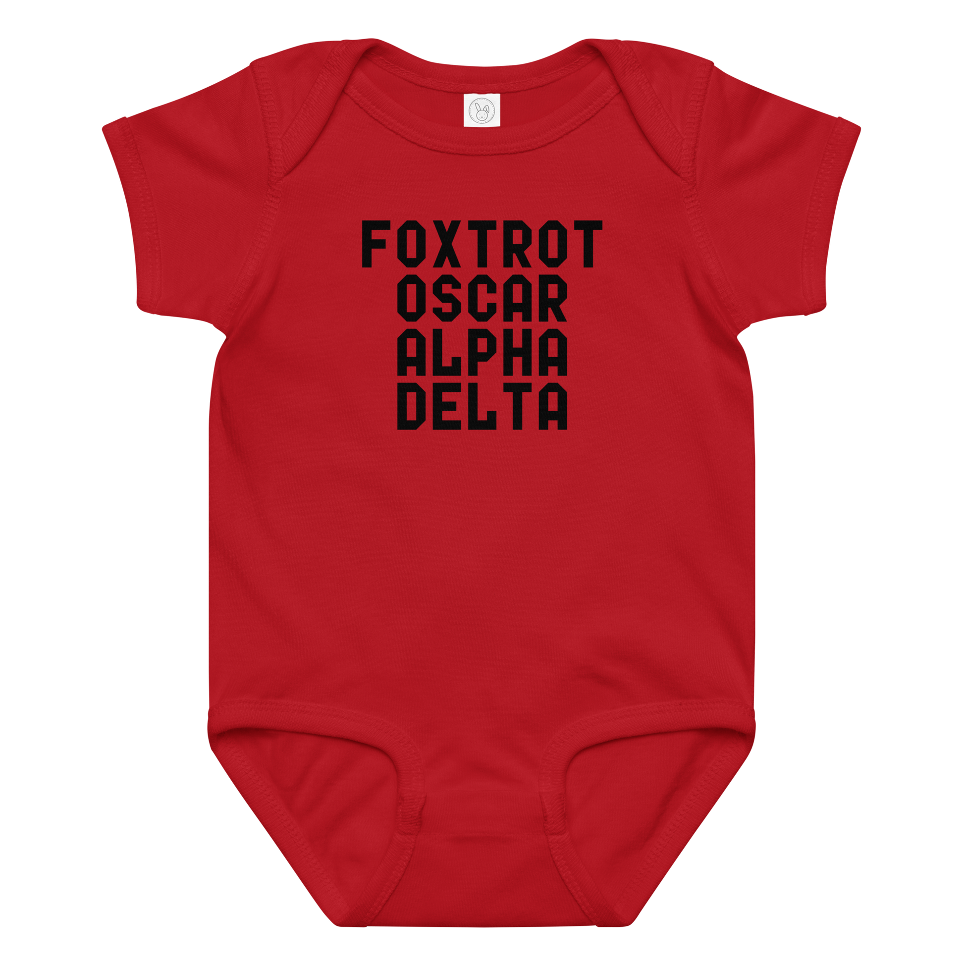 "Foxtrot Oscar Alpha Delta" printed on a red baby jersey bodysuit laying on a flat surface amongst other clothes