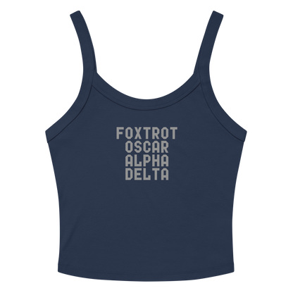 "Foxtrot Oscar Alpha Delta" printed on a solid navy blend women's micro-rib tanktop laying on a flat surface amongst sunglasses and shorts