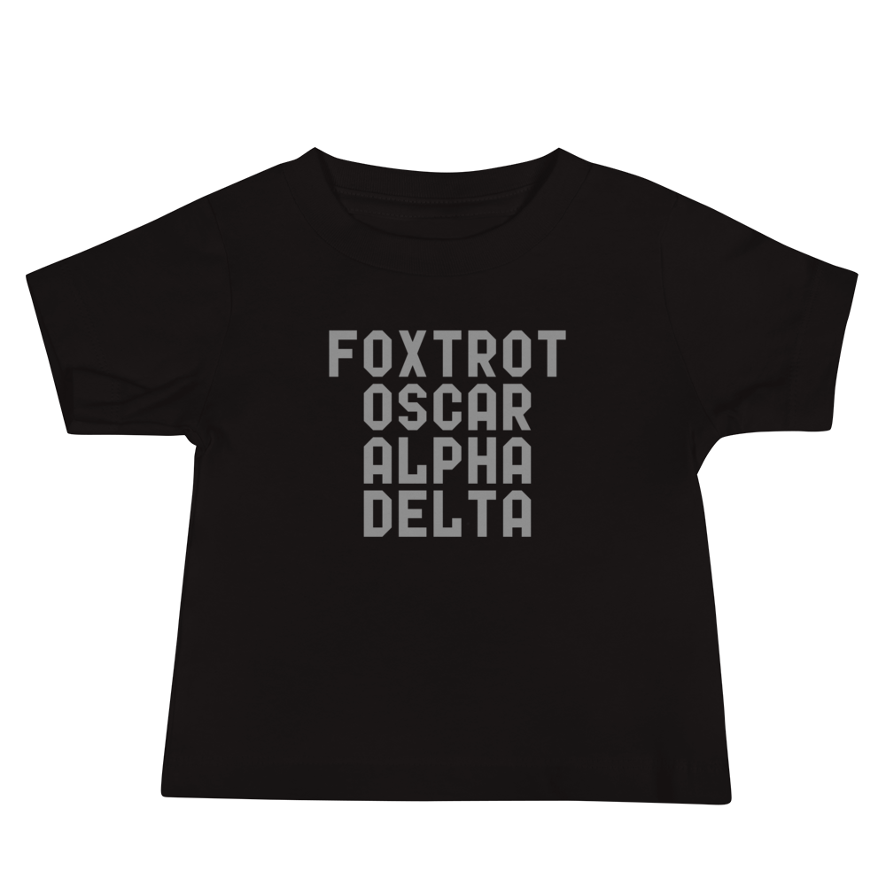 "Foxtrot Oscar Alpha Delta" printed on a black baby jersey short sleeve tee laying on a flat surface