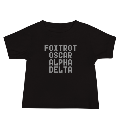 "Foxtrot Oscar Alpha Delta" printed on a black baby jersey short sleeve tee laying on a flat surface