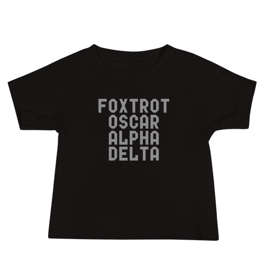 "Foxtrot Oscar Alpha Delta" printed on a black baby jersey short sleeve tee laying on a flat surface