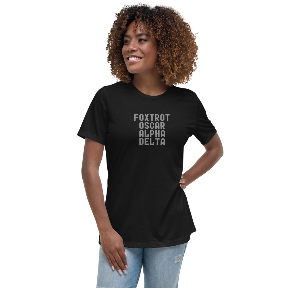 "Foxtrot Oscar Alpha Delta" printed on a black women's relaxed t-shirt worn by a female