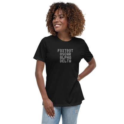 "Foxtrot Oscar Alpha Delta" printed on a black women's relaxed t-shirt worn by a female