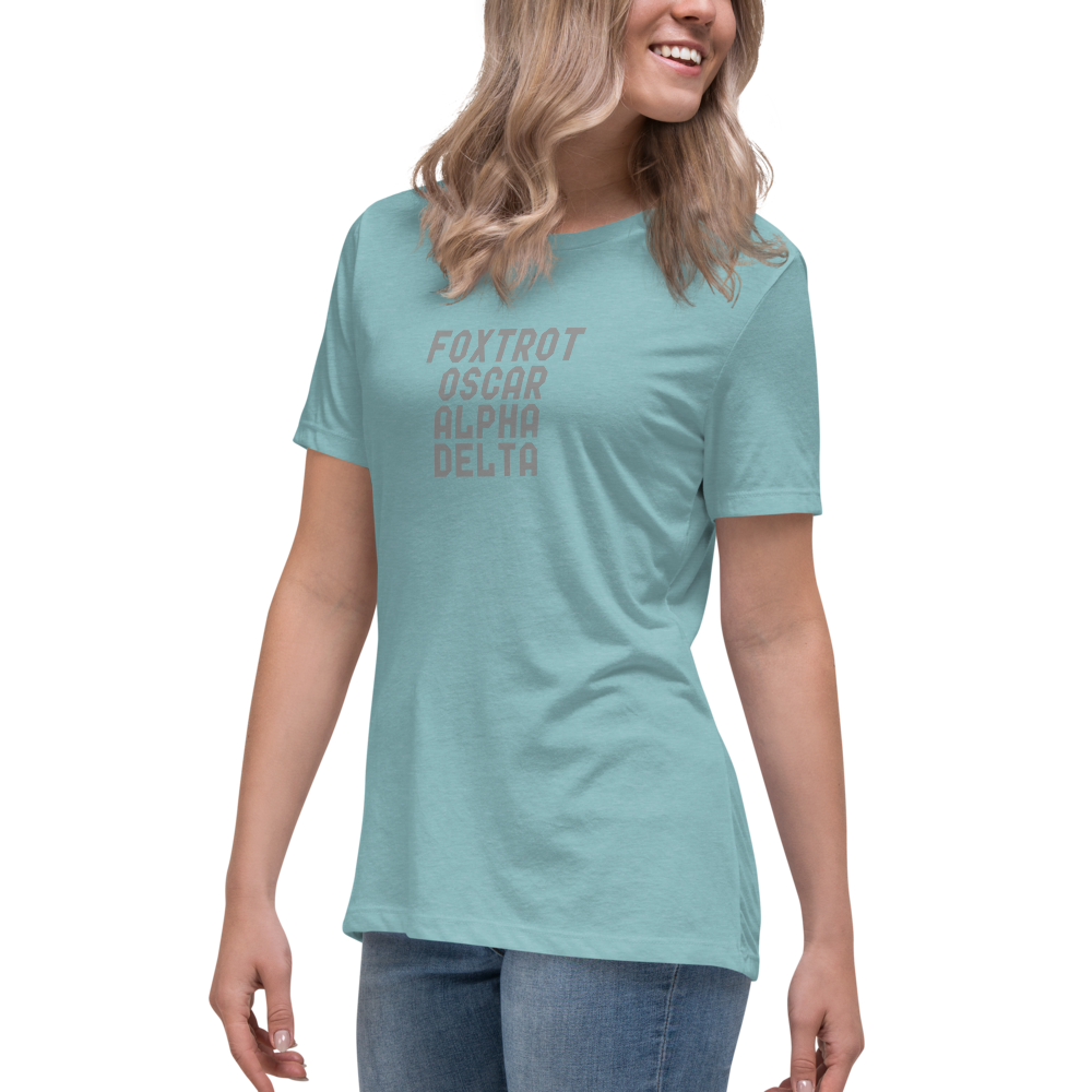 "Foxtrot Oscar Alpha Delta" printed on a heather blue lagoon women's relaxed t-shirt worn by a female