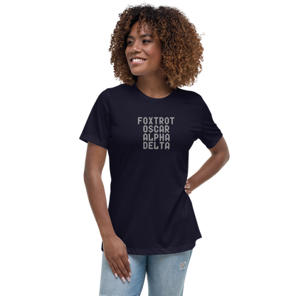 "Foxtrot Oscar Alpha Delta" printed on a navy women's relaxed t-shirt worn by a female