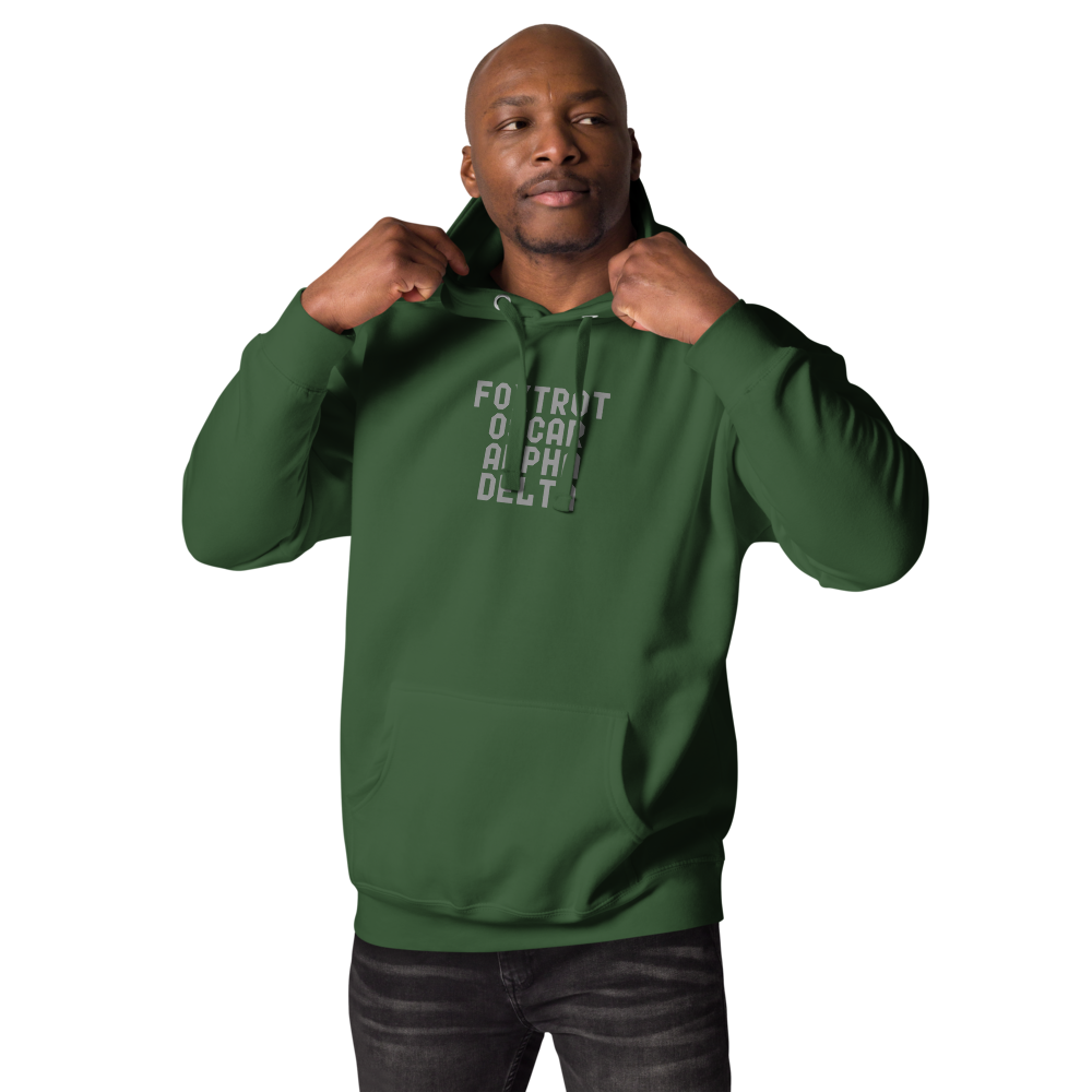 "Foxtrot Oscar Alpha Delta" printed on a forest green unisex hoodie worn by a male