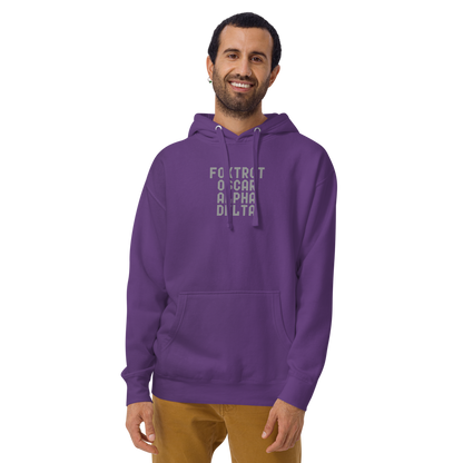"Foxtrot Oscar Alpha Delta" printed on a purple warn by a male
