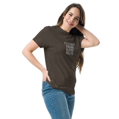 "Foxtrot Oscar Alpha Delta" printed on a dark chocolate unisex classic tee worn by a female