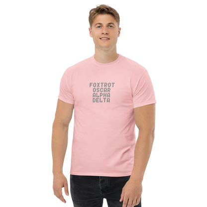 "Foxtrot Oscar Alpha Delta" printed on a light pink unisex classic tee worn by a male