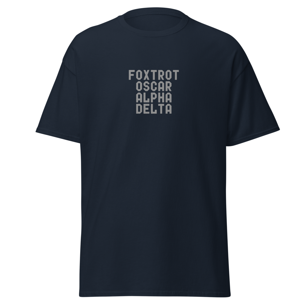 "Foxtrot Oscar Alpha Delta" printed on a navy unisex classic tee laying on a flat surface