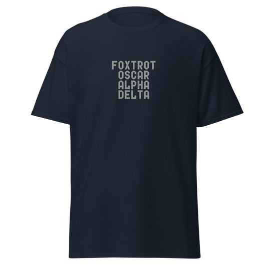 "Foxtrot Oscar Alpha Delta" printed on a navy unisex classic tee laying on a flat surface