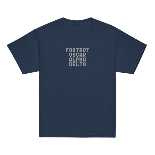 "Foxtrot Oscar Alpha Delta" printed on a navy youth classic tee laying on a flat surface