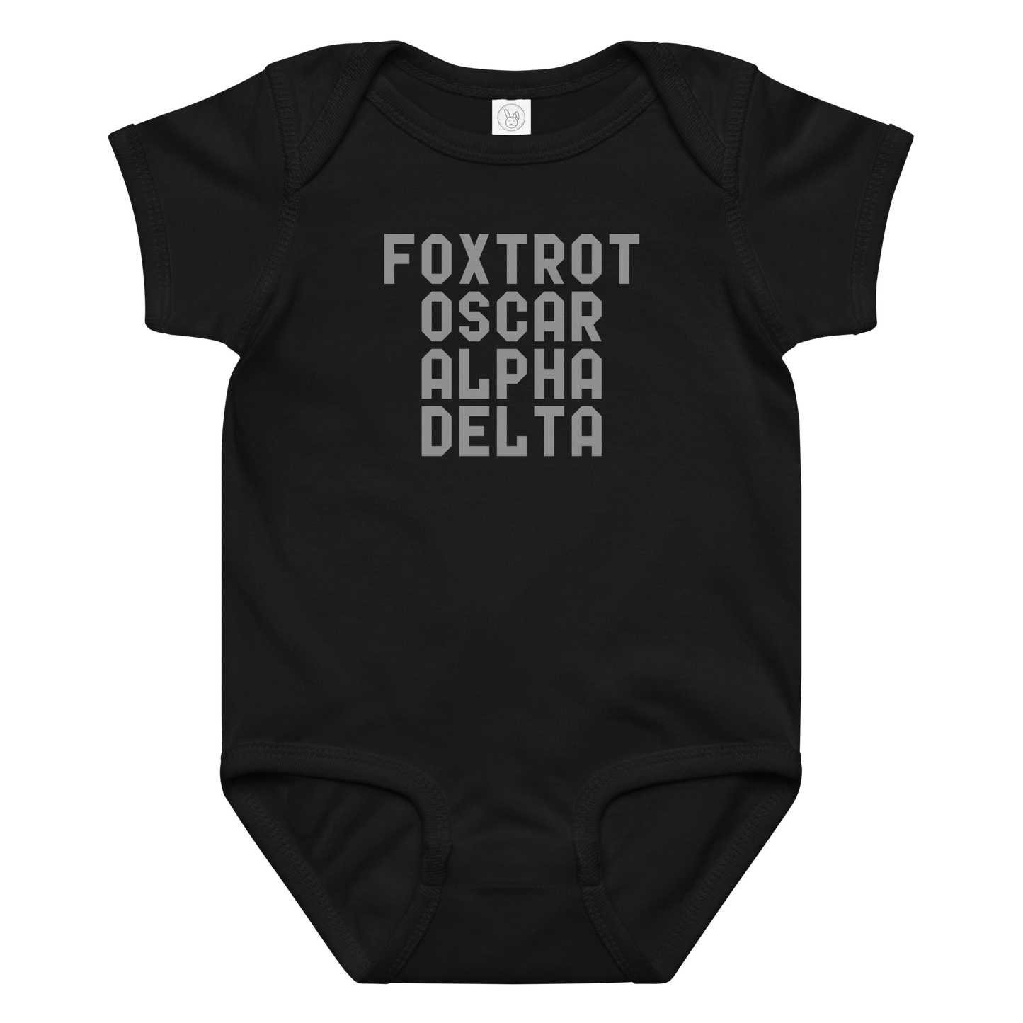 "Foxtrot Oscar Alpha Delta" printed on a black baby jersey bodysuit laying on a flat surface amongst other clothes