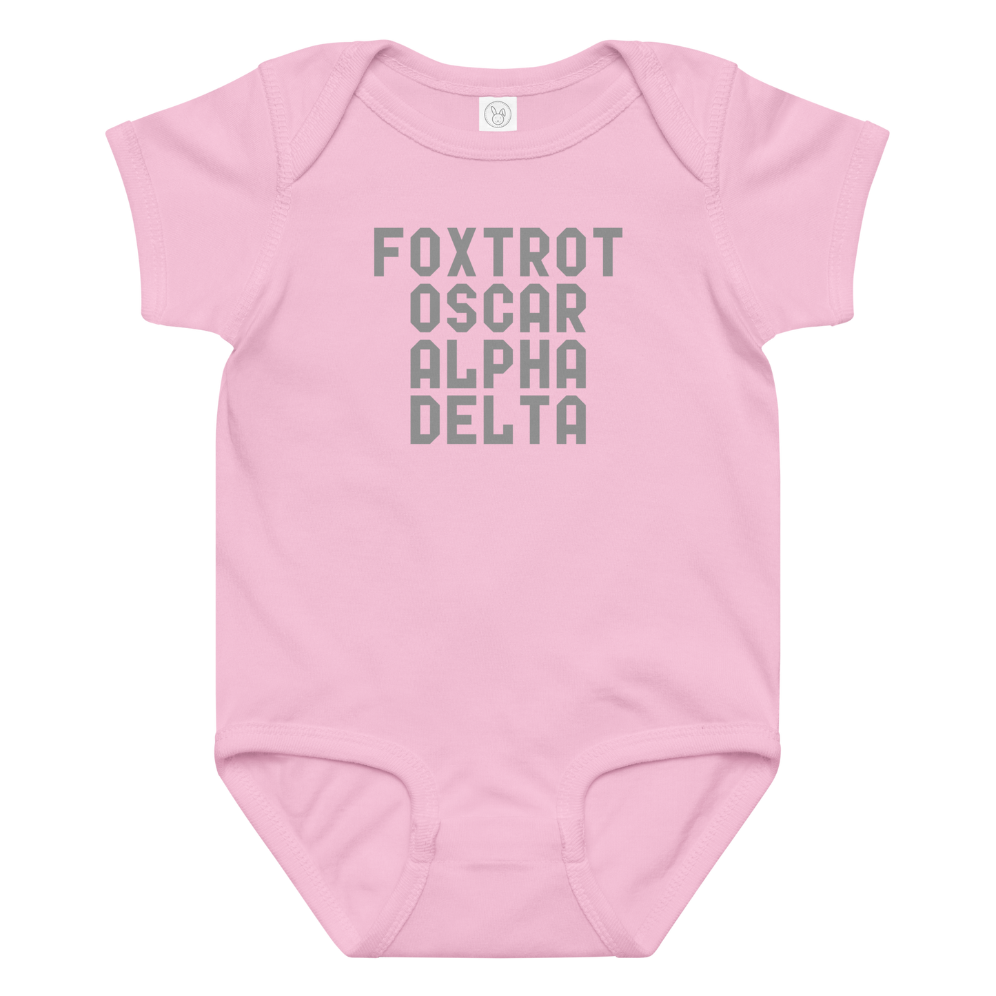 "Foxtrot Oscar Alpha Delta" printed on a pink baby jersey bodysuit laying on a flat surface amongst other clothes