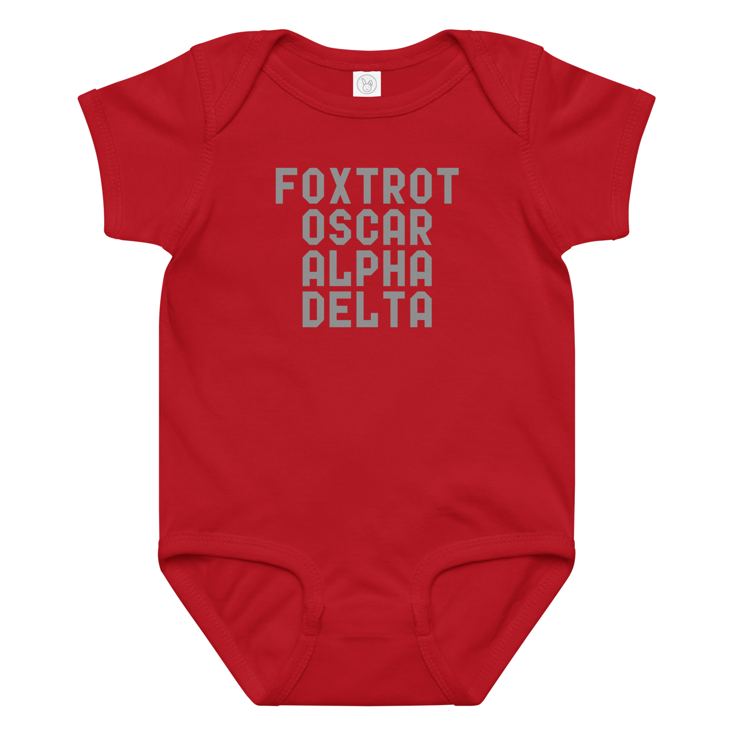 "Foxtrot Oscar Alpha Delta" printed on a red baby jersey bodysuit laying on a flat surface amongst other clothes