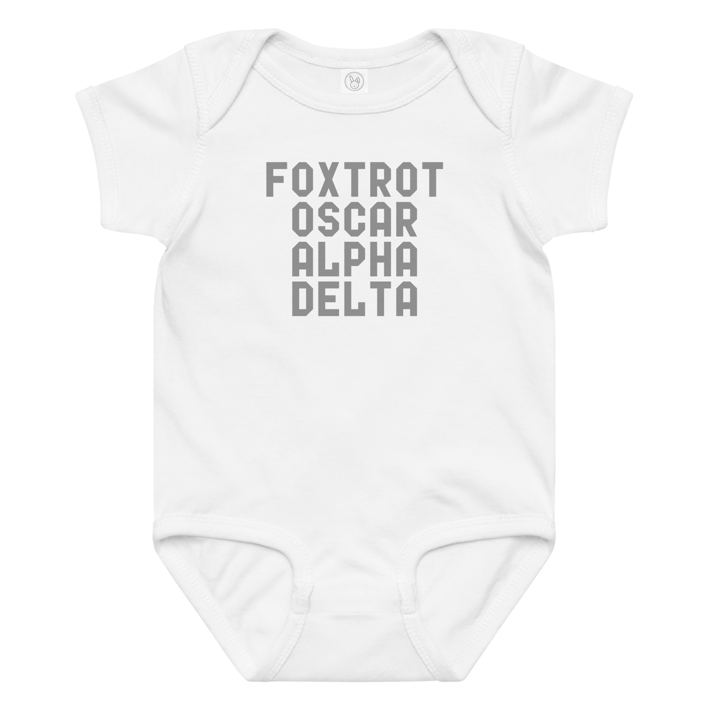 "Foxtrot Oscar Alpha Delta" printed on a white baby jersey bodysuit laying on a flat surface amongst other clothes