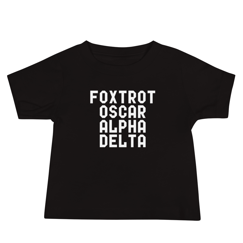 "Foxtrot Oscar Alpha Delta" printed on a black baby jersey short sleeve tee laying on a flat surface