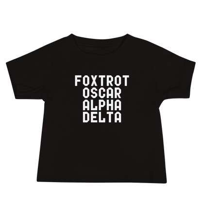 "Foxtrot Oscar Alpha Delta" printed on a black baby jersey short sleeve tee laying on a flat surface