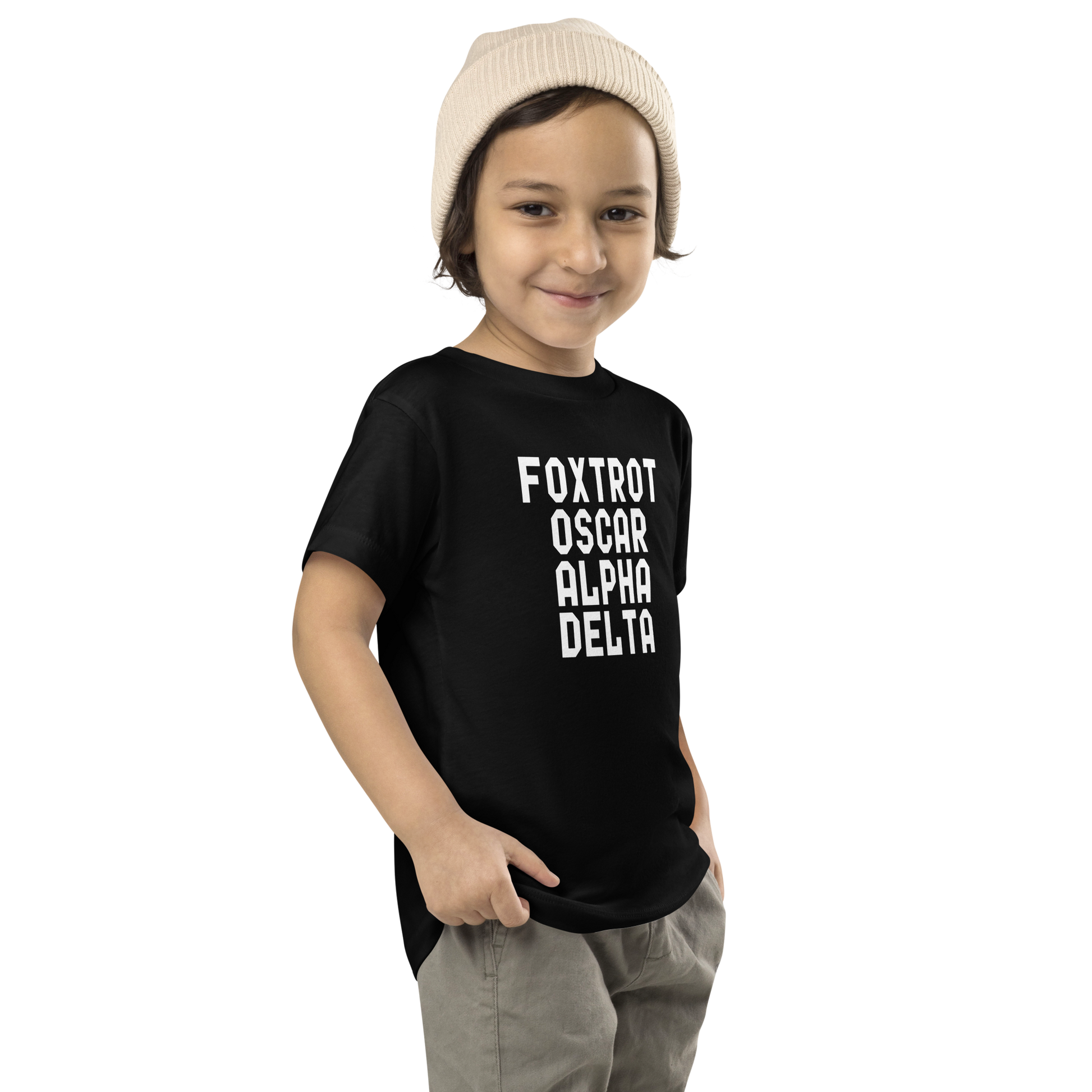 "Foxtrot Oscar Alpha Delta" printed on a black toddler short sleeve tee worn by a male who is also wearing a knit cap