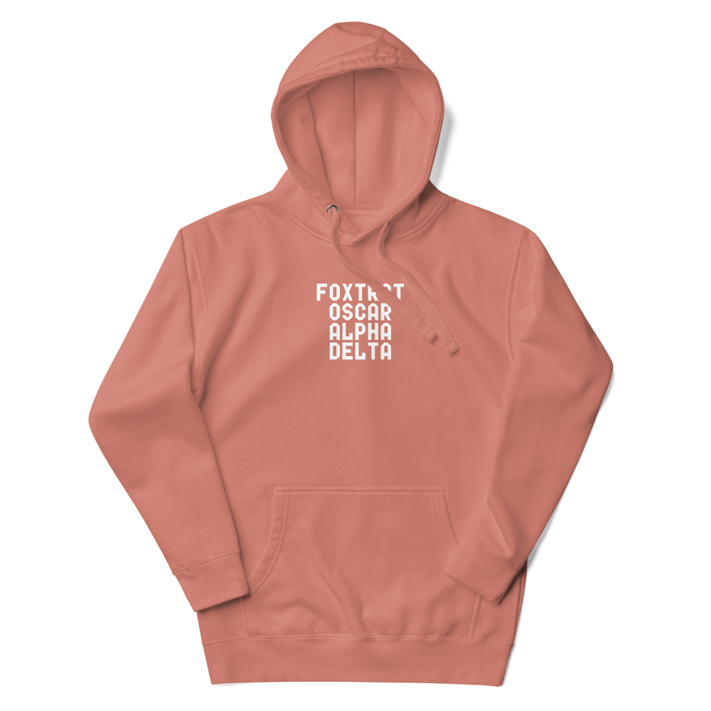 "Foxtrot Oscar Alpha Delta" printed on a dusty rose unisex hoodie laying on a flat surface with the hood up