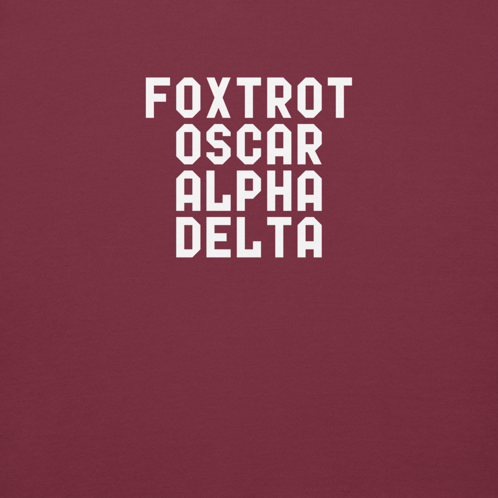 "Foxtrot Oscar Alpha Delta" printed on a maroon background