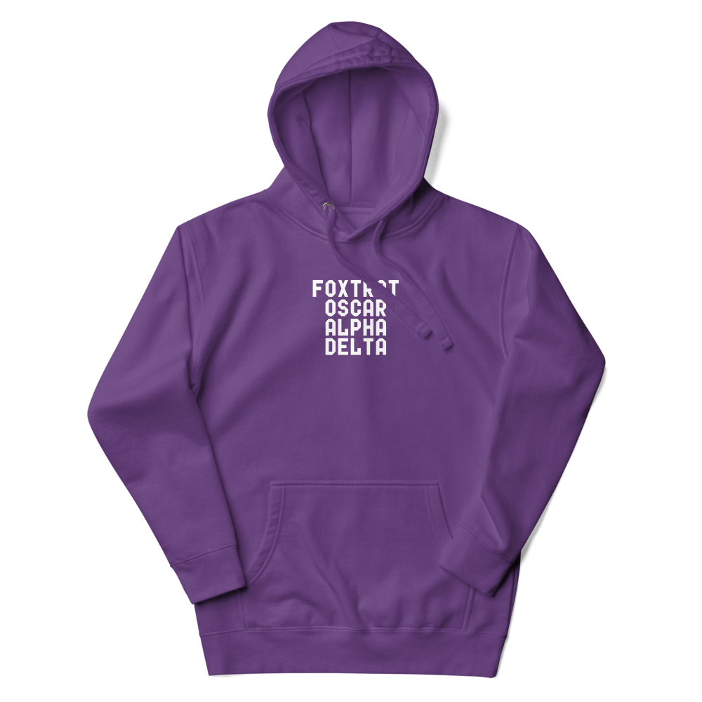 "Foxtrot Oscar Alpha Delta" printed on a purple unisex hoodie laying on a flat surface with the hood up