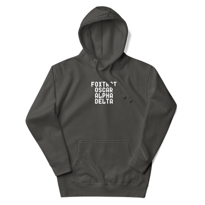 "Foxtrot Oscar Alpha Delta" printed on a vintage black unisex hoodie laying on a flat surface with the hood up